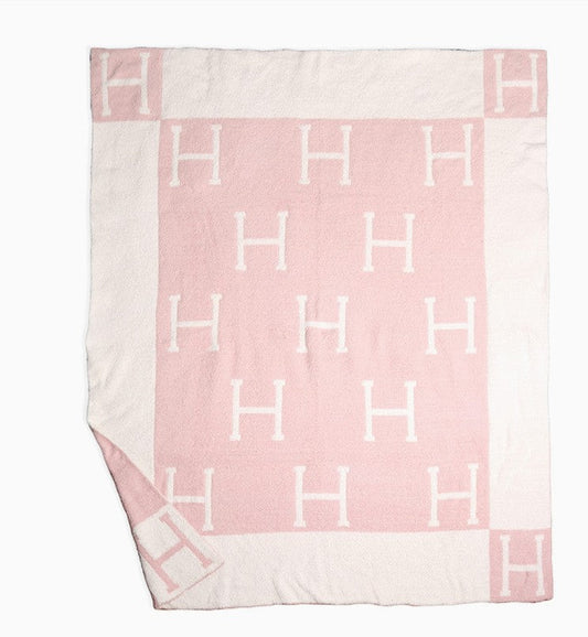 ‘H’ Monogram Patterned Reversible Throw Blanket in Pink