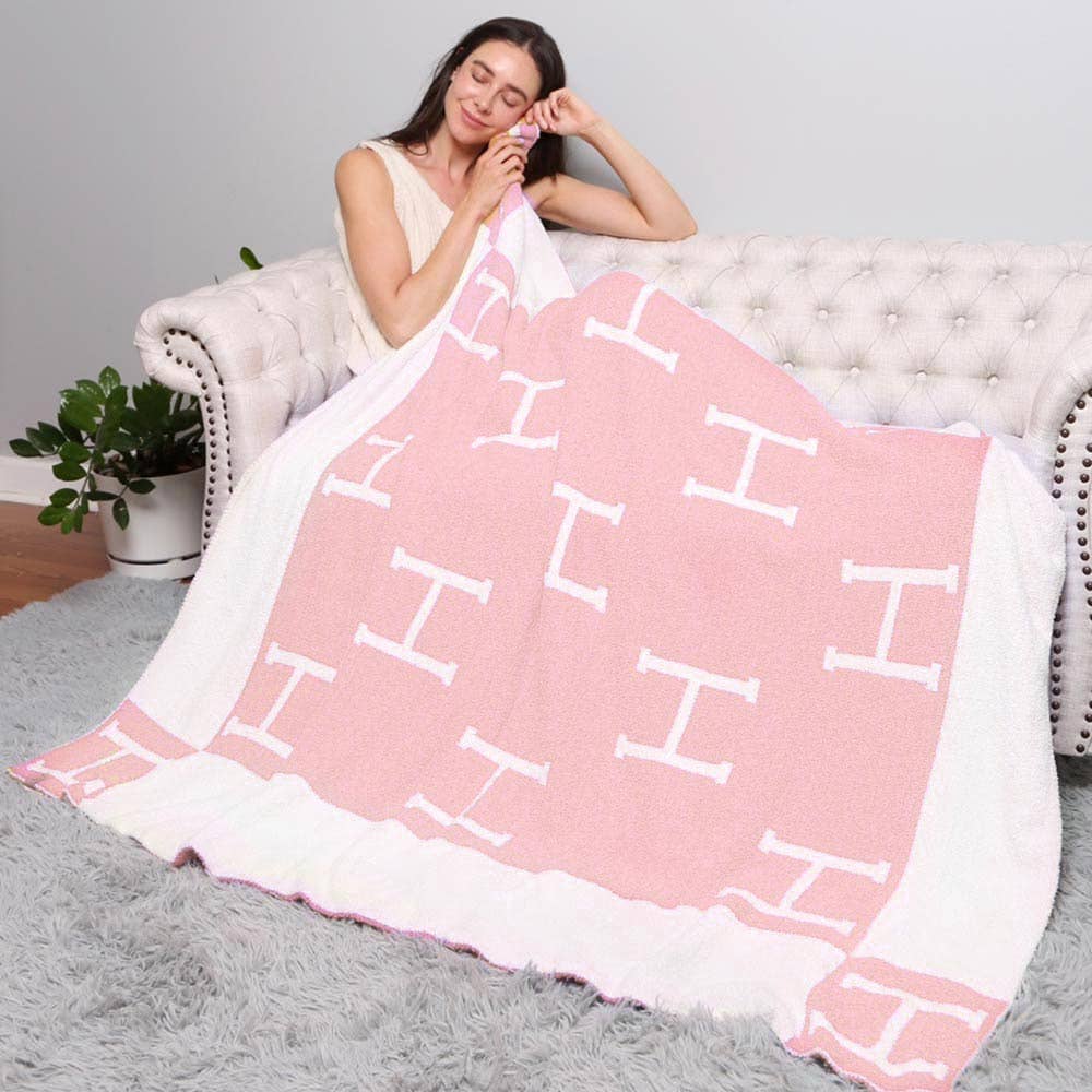 ‘H’ Monogram Patterned Reversible Throw Blanket in Pink